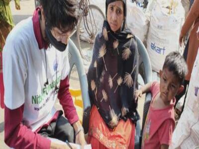 NGO Rahi volunteer engaging with a family in the community