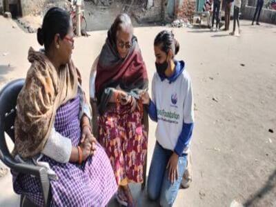 NGO Rahi volunteer engaging with families in the community